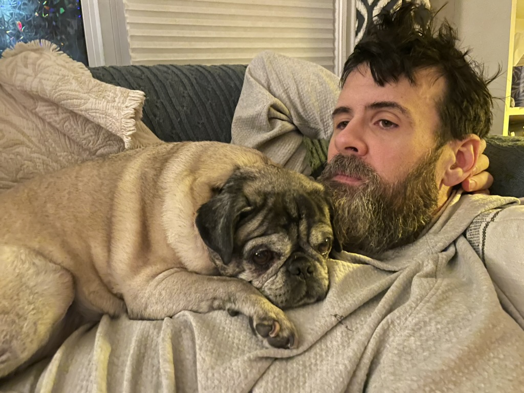 Day 5 — me and my pug Doug relaxing on the couch after a smoke detector emergency morning